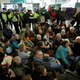 An array of people staged a sit-down protest to prevent people, including police, from entering the London City Airport on Thursday, October 10, 2019.
